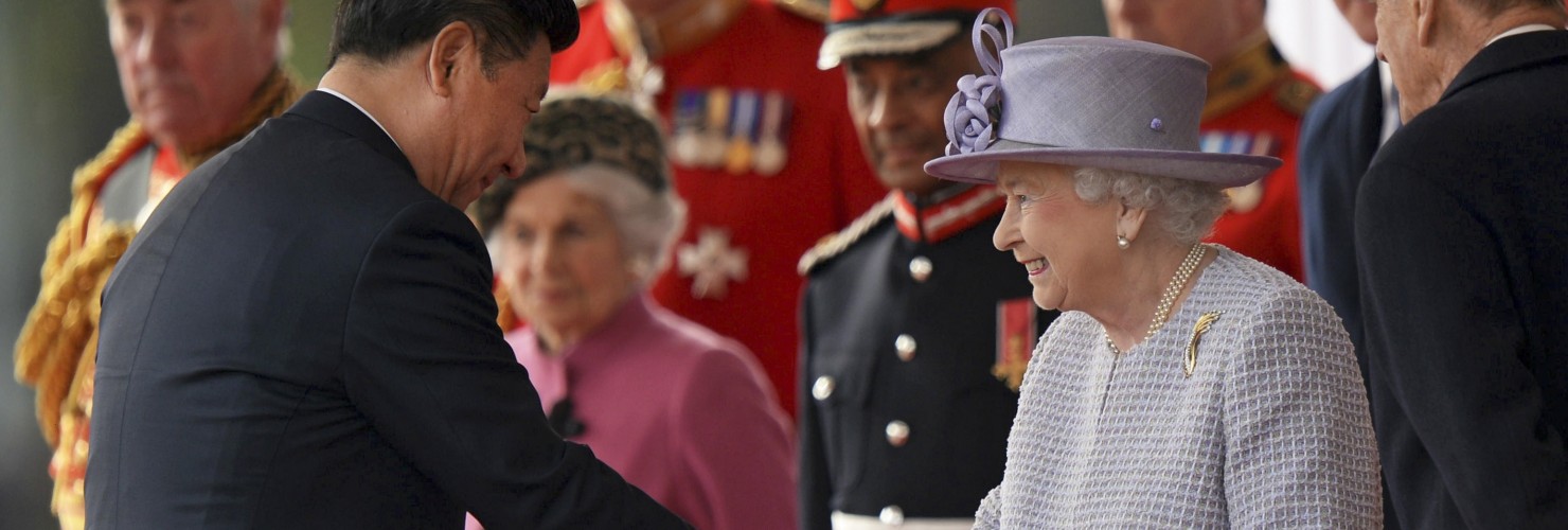 Chinese President Xi Jinping, left, shakes hands with Britain's Queen Elizabeth II in London Tuesday, Oct. 20, 2015, on the first day of their state visit to the United Kingdom. 