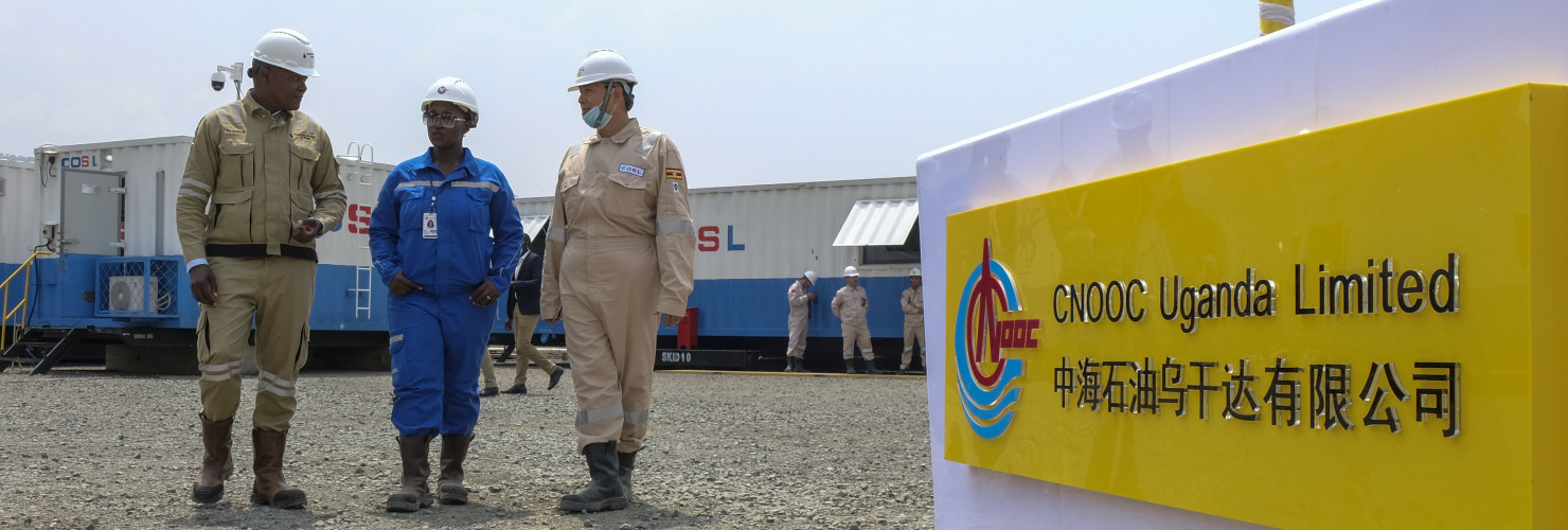 Ugandan and Chinese workers at an oil field in western Uganda