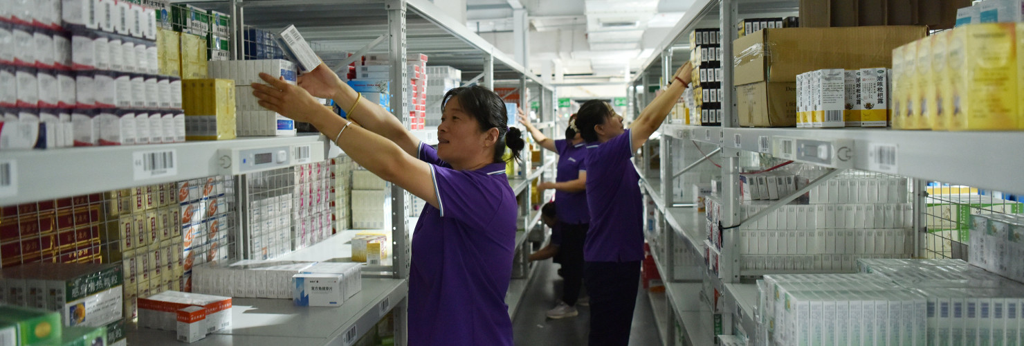 Employees sort out drugs at a pharmaceutical logistics company in Zhangjiakou, Hebei province, China